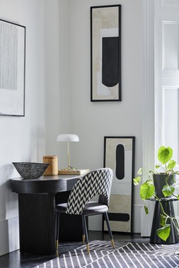 Dwell Cosma Black Ribbed Office Desk, available at DFS, Dwell Comida Print Dining Chair in Black and Grey, available at DFS