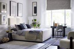 DFS Bryony King Size Ottoman Bed Frame in Cream Velvet, available from 18.10.23, Dwell Zya Accent Chair, Dwell Alcina Terrazzo Lamp Table, available at DFS, Dwell Lerato Artwork, available at DFS, Dwell Cosma Black Ribbed Office Desk, available at DFS, Dwell Comida Print Dining Chair in Black and Grey, available at DFS, DFS Kalel Medium Rug, Dwell Niscemi Reversible Medium Rug, available at DFS