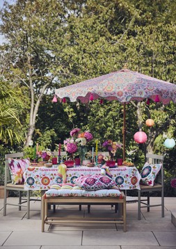 Nylon rope planters, from £12, Cushions, from £15, Beldi floral tablecloth £35, Beldi floral bench pad £45, Beldi floral parasol £89, Paper lanterns, set of 3 £25, Nylon rope lanterns, from £12 & Giant daisy stake £22