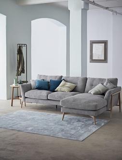 Furniture Village – ercol Bellaria Chaise Sofa, &pound;2,205, Madrid Table Lamp, &pound;189, Chic Fabric Scatter Cushion, &pound;35, Cube Velour Teal Cushion, &pound;29 (2