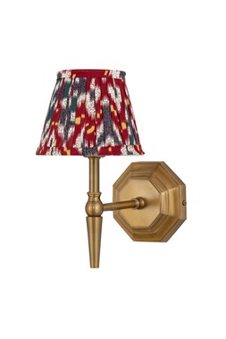Single brass wall light with red and blue pleated shade