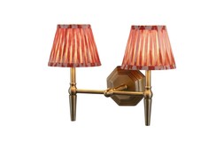 Double brass wall light with orange pleated shade