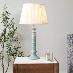 Blue enamel table lamp with neutral pleated shade